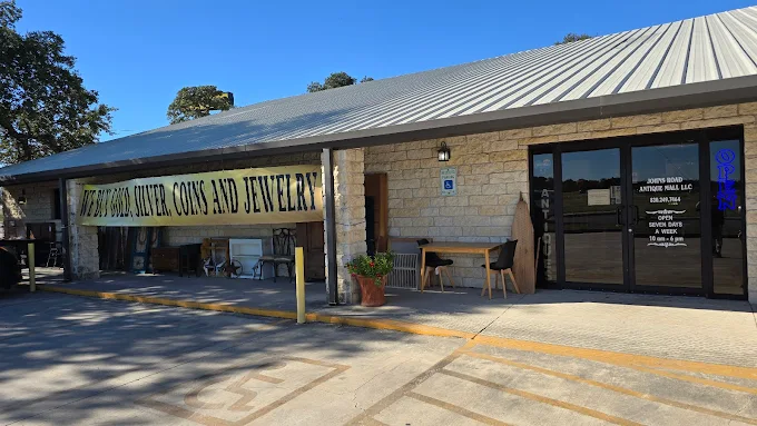 Johns Road Antique Mall Building Exterior and Entrance Exterior of Johns Road Antique Mall, a stone building with a metal roof